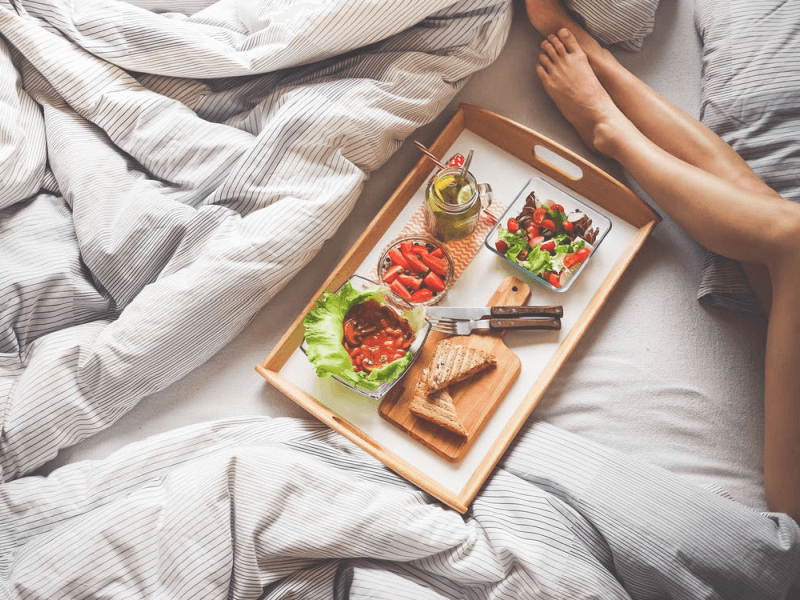 An assortment of food on a bed