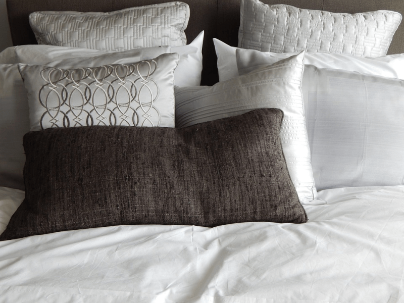 Assorted pillows on a bed