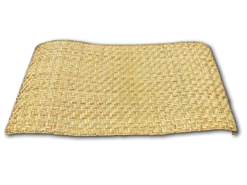 Unrolled petate handwoven mat on white background