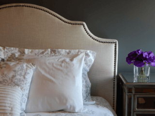 bed-pillows-nightstand-flowers-bedroom-design
