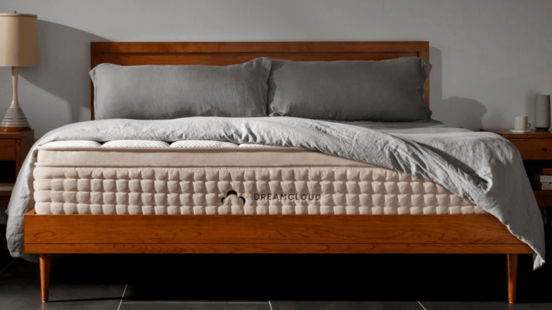 Dreamcloud mattress on varnished wooden frame