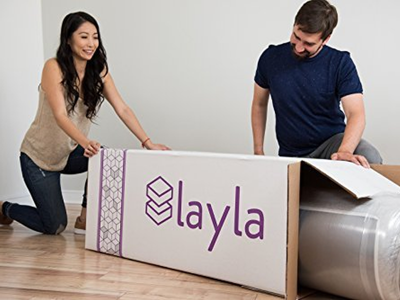 Layla Mattress being unboxed by man and woman
