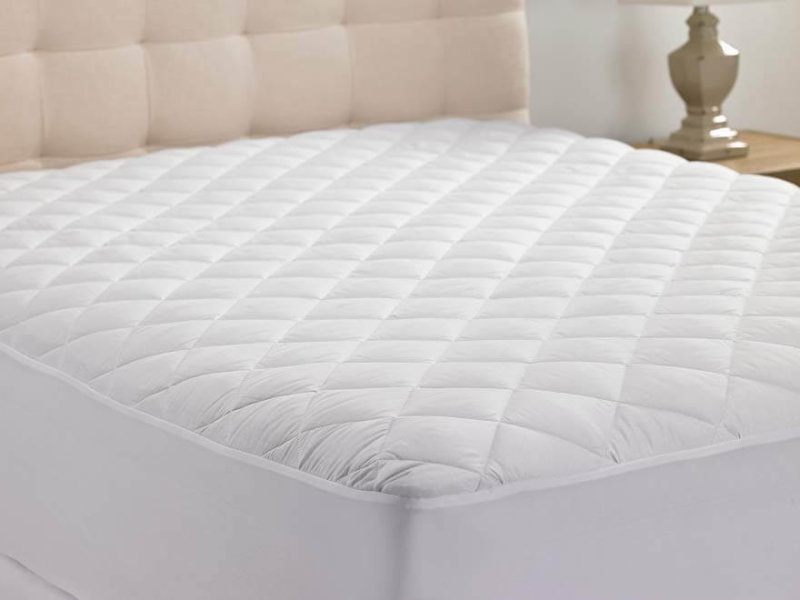 White Hanna Kay Extra-Deep Quilted Mattress Pad on mattress
