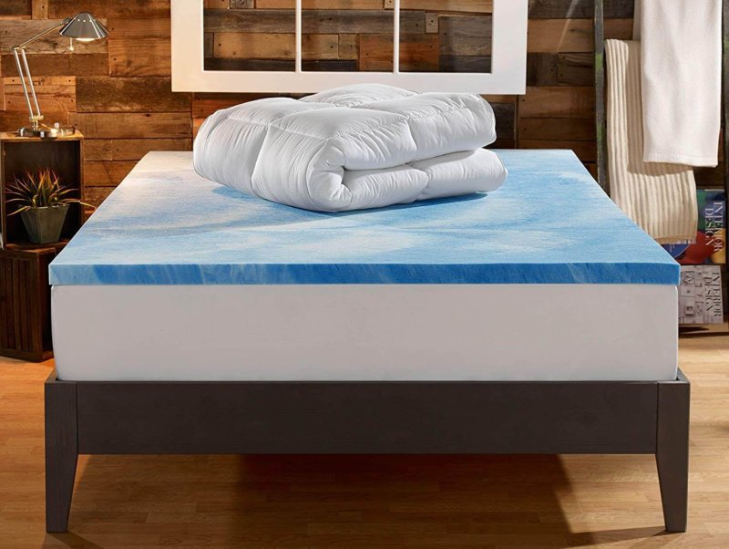 Sleep Innovations Dual Layer Mattress Topper deconstructed on mattress in messy bedroom